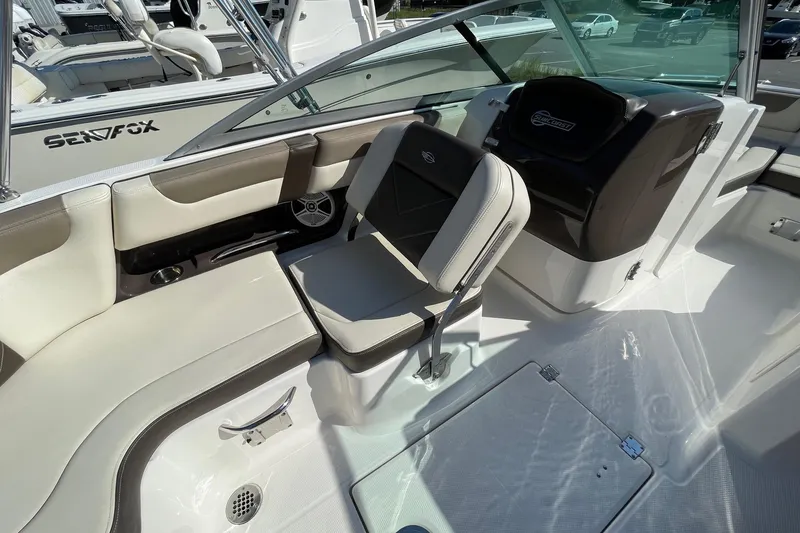 Slide: The Image of 2019 Chaparral 210 Suncoast boat interior with seating and helm, featuring modern design. - 23