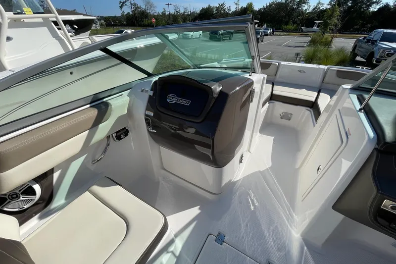 Slide: The Image of 2019 Chaparral 210 Suncoast boat interior with seating and steering console. - 24