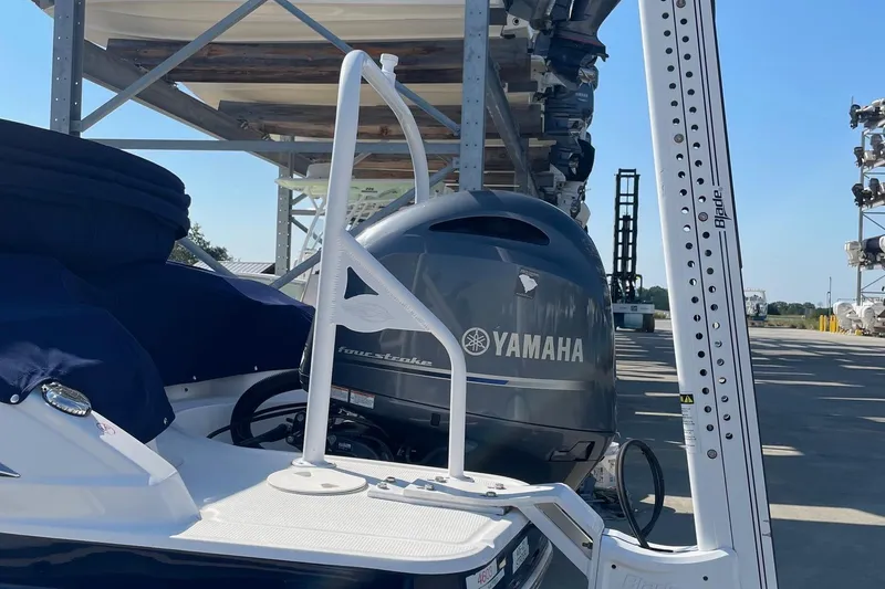 Slide: The Image of 2019 Chaparral 210 Suncoast boat with Yamaha outboard engine in storage facility. - 31