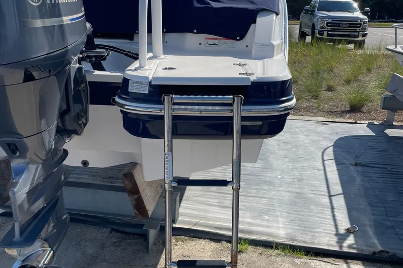 Slide: The Image of 2019 Chaparral 210 Suncoast boat with Yamaha engine and extended swim platform. - 32