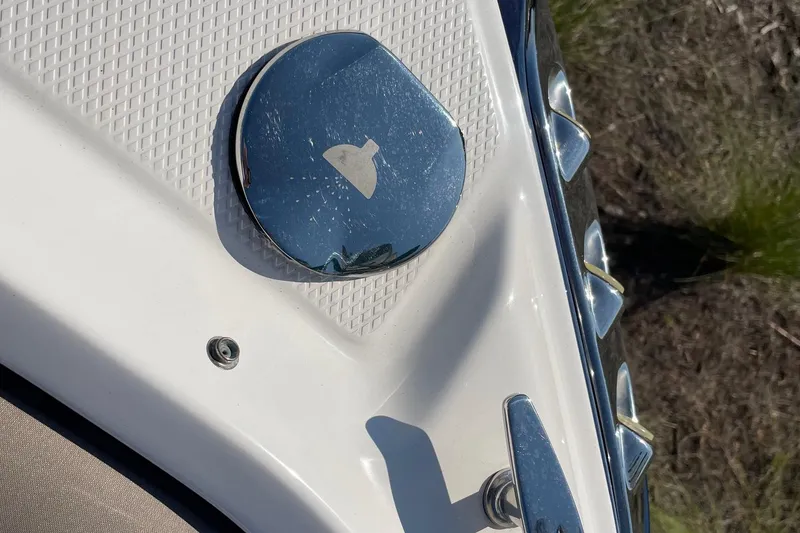 Slide: The Image of Close-up of 2019 Chaparral 210 Suncoast boat's chrome fuel cap and cleat. - 36