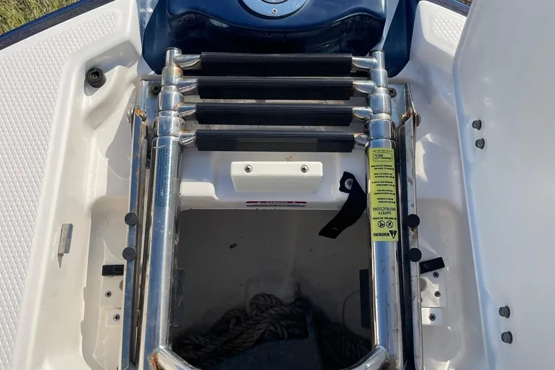 Slide: The Image of 2019 Chaparral 210 Suncoast boat ladder and storage compartment. - 38