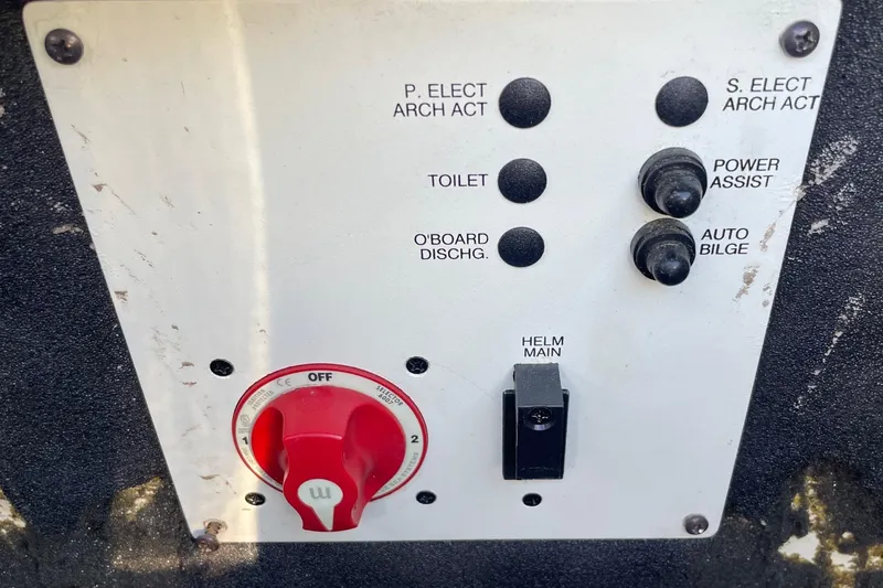 Slide: The Image of Control panel of a 2019 Chaparral 210 Suncoast boat with various switches and dials. - 39