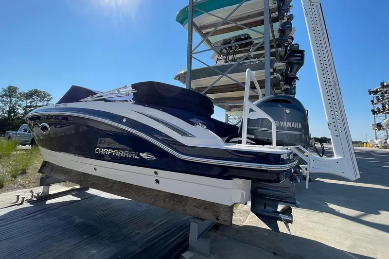 Slide: The Image of 2019 Chaparral 210 Suncoast boat on dry dock with Yamaha engine. - 7