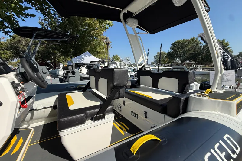 Slide: The Image of Highfield VELOX 560 boat interior, 2025 model, featuring sleek seating and modern design. - 3