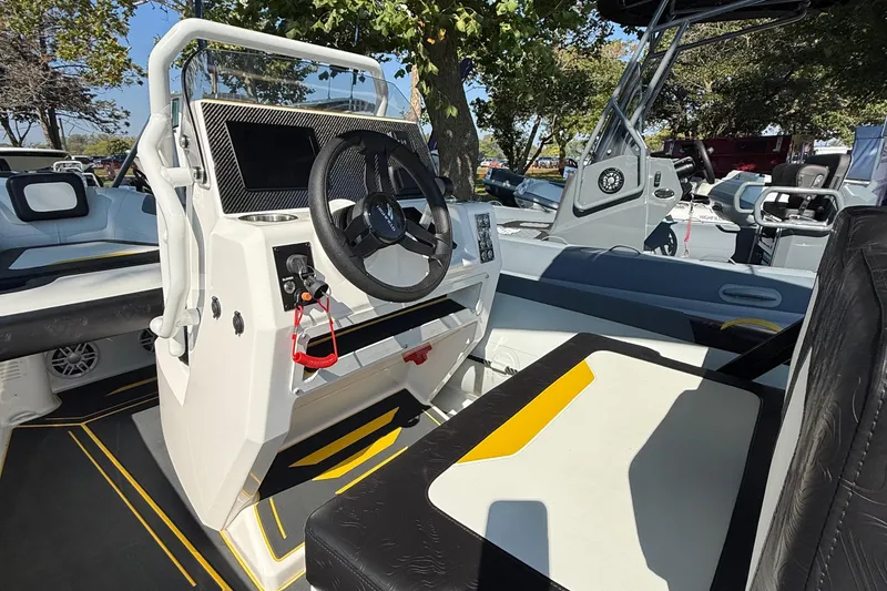 Slide: The Image of 2025 Highfield VELOX 560 boat interior with steering wheel and seating. - 4