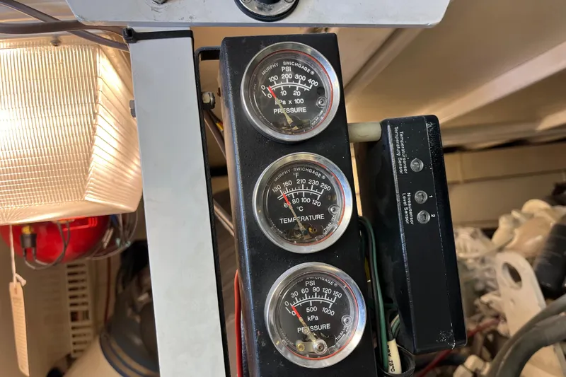 Slide: The Image of Close-up of gauges and sensors on a 1997 Post Sportfish boat. - 13
