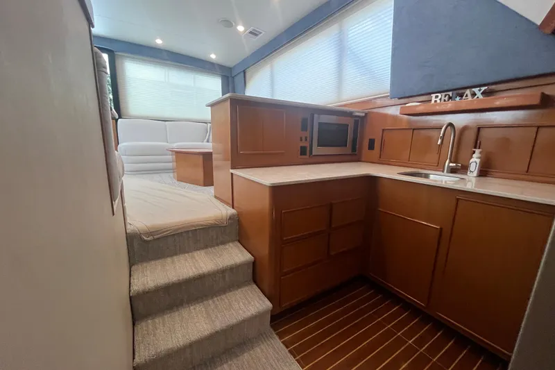 Slide: The Image of Luxurious 1997 Post Sportfish yacht interior with modern kitchen and cozy seating area. - 39