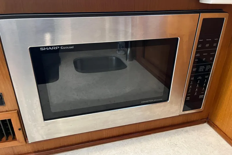 Slide: The Image of Sharp Carousel convection microwave in a 1997 Post Sportfish boat kitchen. - 40