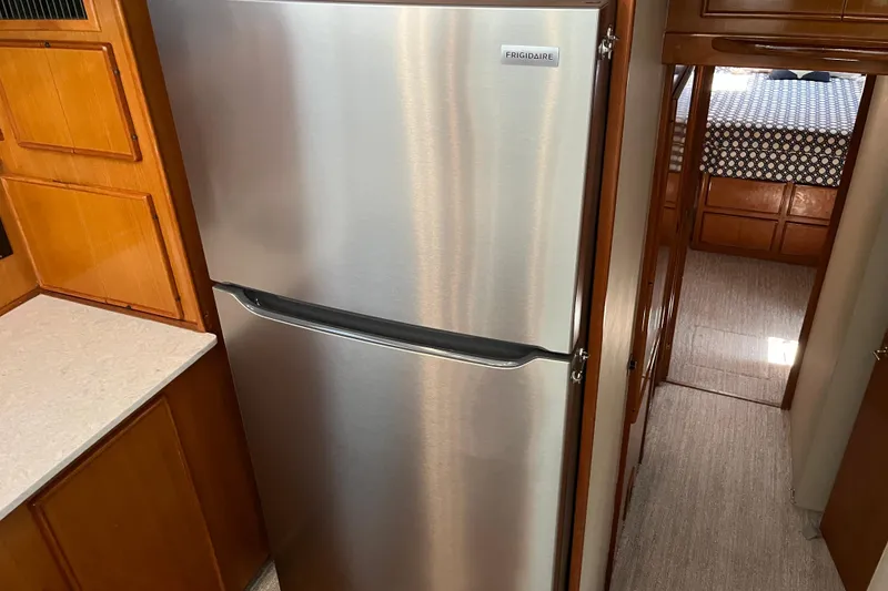 Slide: The Image of Stainless steel Frigidaire refrigerator in 1997 Post Sportfish yacht kitchen. - 41