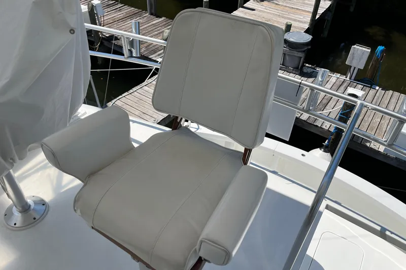 Slide: The Image of White captain's chair on 1997 Post Sportfish boat, dockside view. - 55