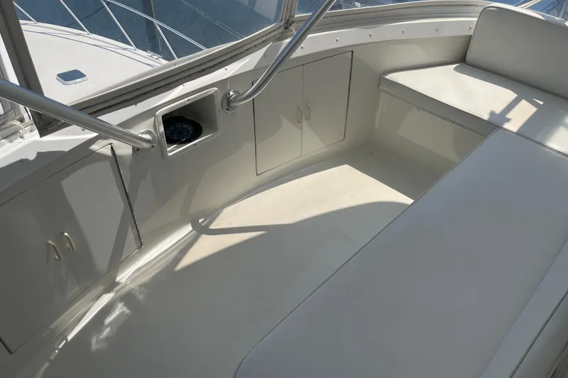 Slide: The Image of 1997 Post Sportfish boat interior with seating and storage compartments. - 59