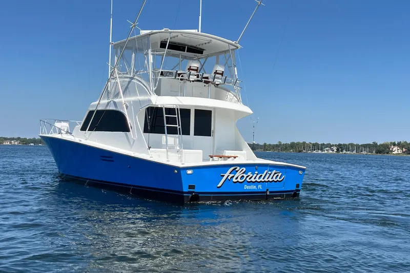 Slide: The Image of 1997 Post Sportfish boat "Floridita" on water, Destin, FL, clear blue sky. - 6