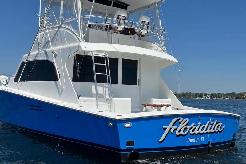 Slide: The Image of 1997 Post Sportfish boat "Floridita" in Destin, FL, on calm waters under clear skies. - 7