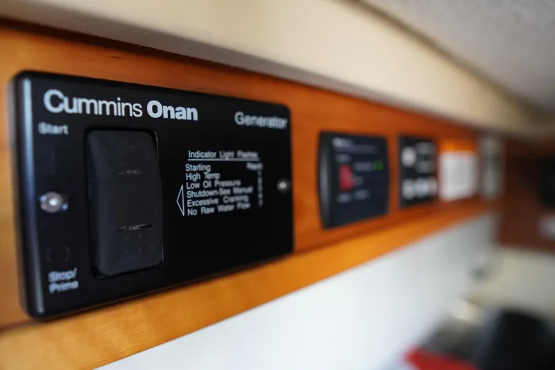 Slide: The Image of Control panel of a 2015 Cutwater 30 Command Bridge with Cummins Onan generator. - 14