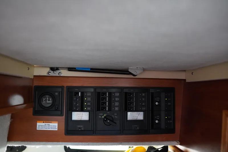 Slide: The Image of Control panel of 2015 Cutwater 30 Command Bridge boat, featuring various switches and gauges. - 21