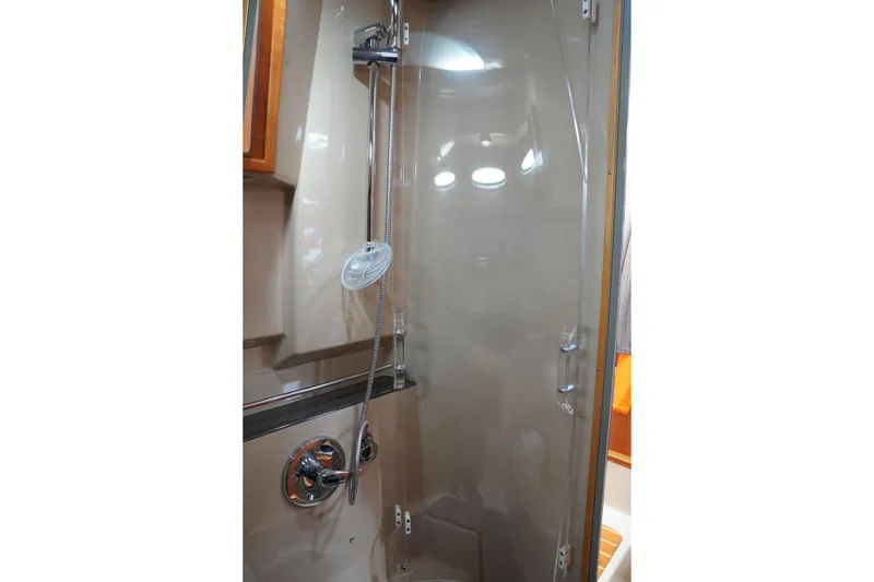 Slide: The Image of Shower area in 2015 Cutwater 30 Command Bridge boat, featuring modern fixtures. - 23