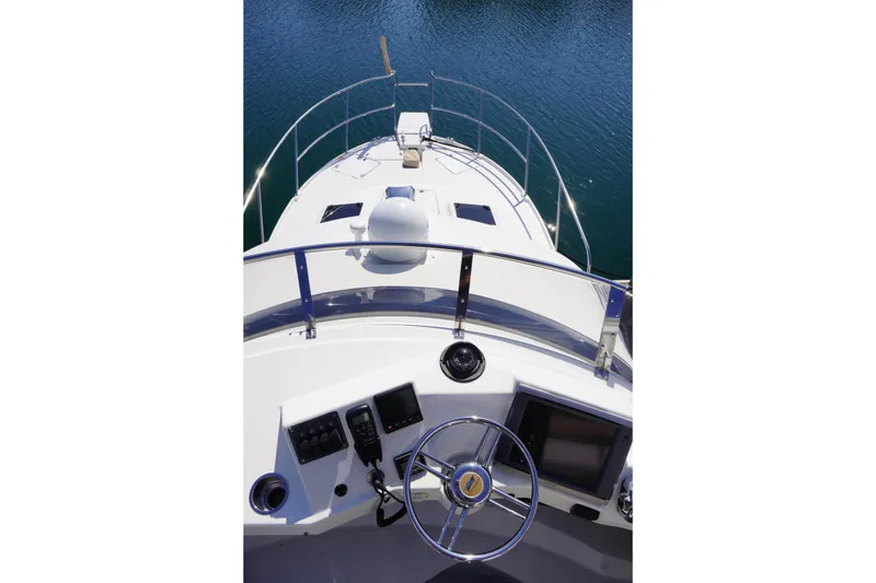 Slide: The Image of 2015 Cutwater 30 Command Bridge helm view with steering wheel and navigation controls. - 3