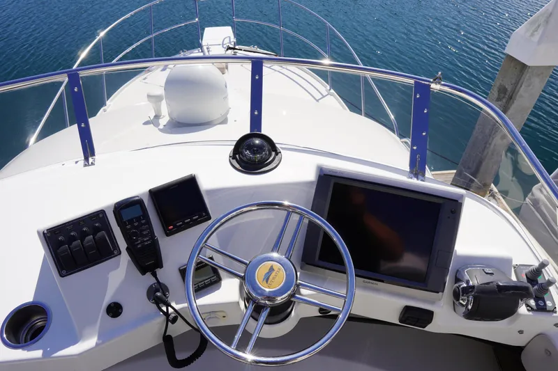 Slide: The Image of Helm of 2015 Cutwater 30 Command Bridge with navigation equipment and steering wheel. - 4