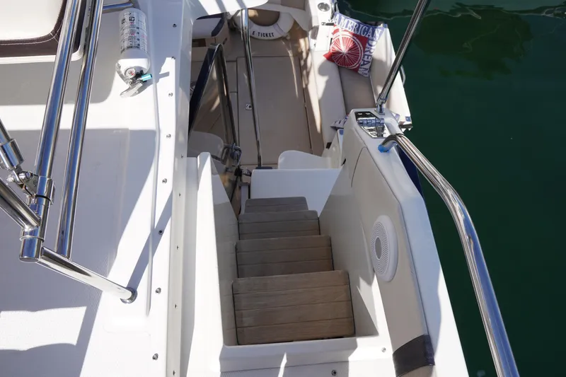 Slide: The Image of Staircase on 2015 Cutwater 30 Command Bridge yacht, featuring sleek design and safety railings. - 7