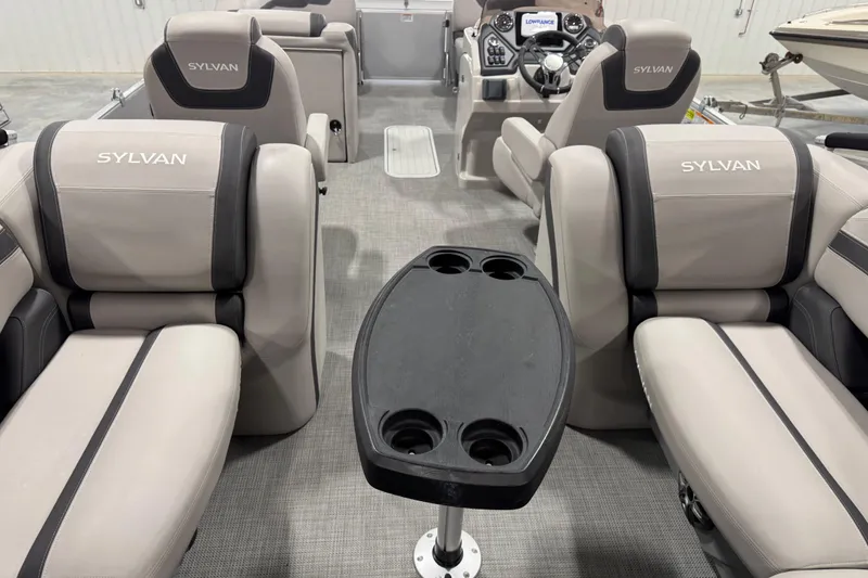 Slide: The Image of Interior of 2022 Sylvan L 5 boat with plush seating and cup holders. - 11