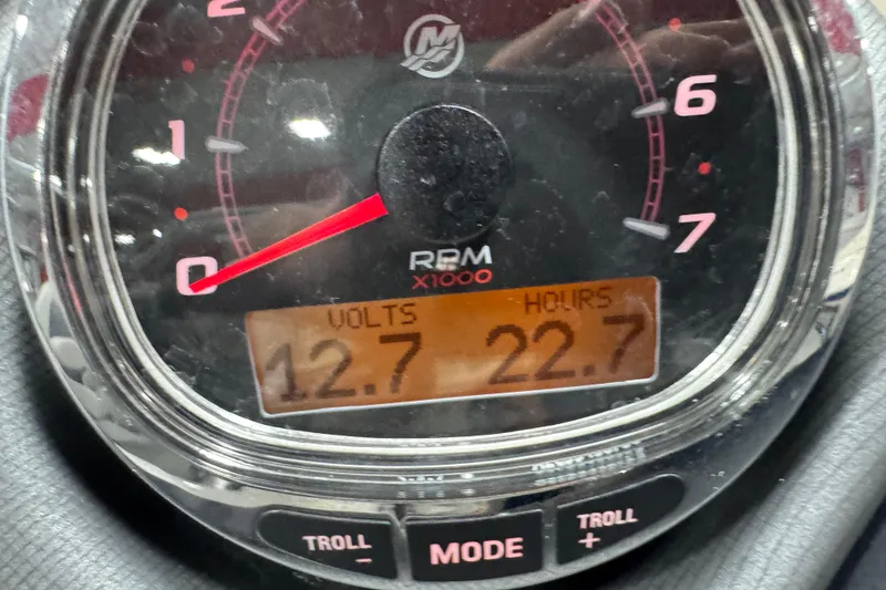 Slide: The Image of Close-up of a Sylvan L 5 2022 gauge showing 12.7 volts and 22.7 hours. - 13