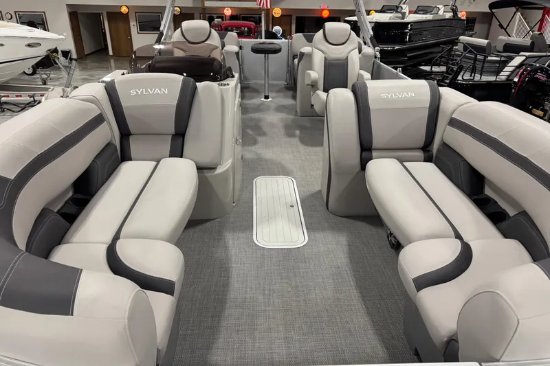 Slide: The Image of 2022 Sylvan L 5 pontoon boat interior with luxurious seating and modern design. - 7