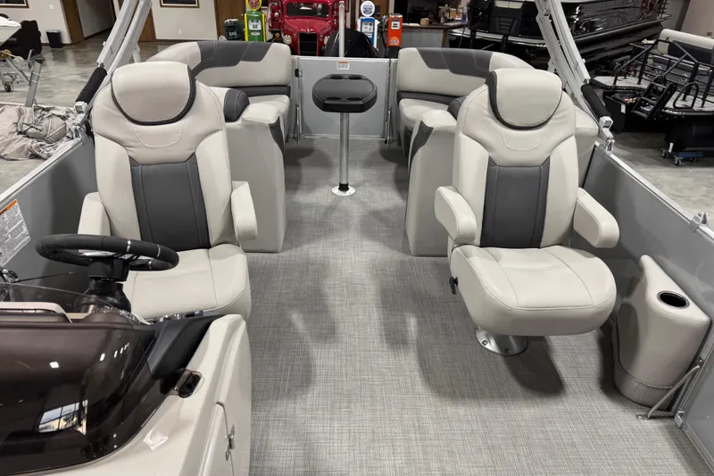 Slide: The Image of 2022 Sylvan L 5 boat interior with plush seating and modern design. - 8