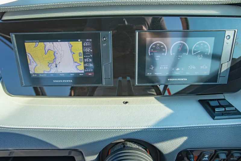 Slide: The Image of Dashboard of a 2020 Regal LS6 boat featuring dual Volvo Penta displays. - 19