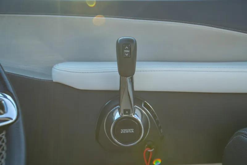 Slide: The Image of 2020 Regal LS6 interior with Volvo Penta throttle control, featuring sleek design and trim adjustment. - 21