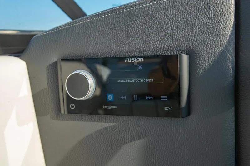 Slide: The Image of Fusion audio system in 2020 Regal LS6 boat, featuring Bluetooth connectivity. - 23