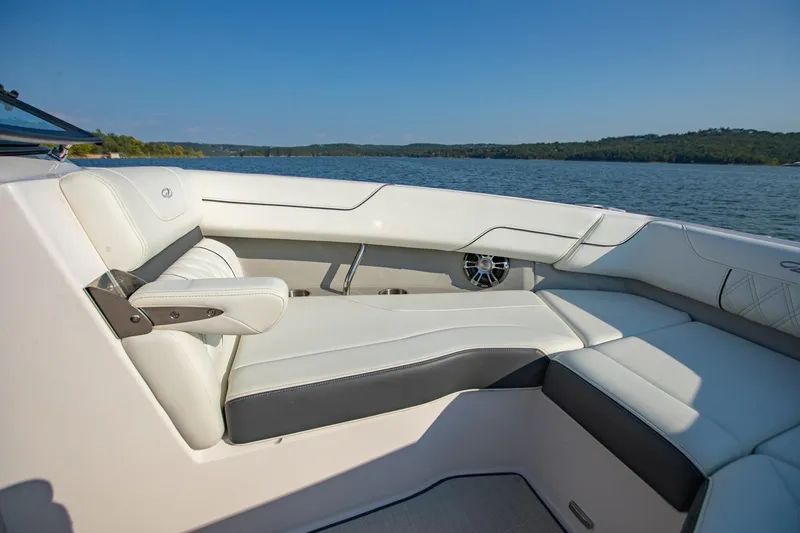 Slide: The Image of Luxurious interior of 2020 Regal LS6 boat with white seating and scenic lake view. - 25
