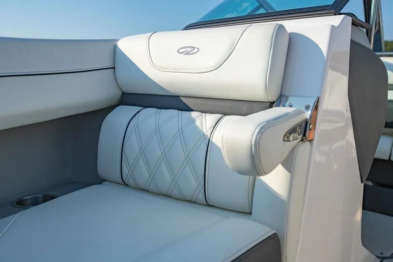 Slide: The Image of Luxurious white leather seating in 2020 Regal LS6 boat, featuring elegant stitching and armrest. - 27