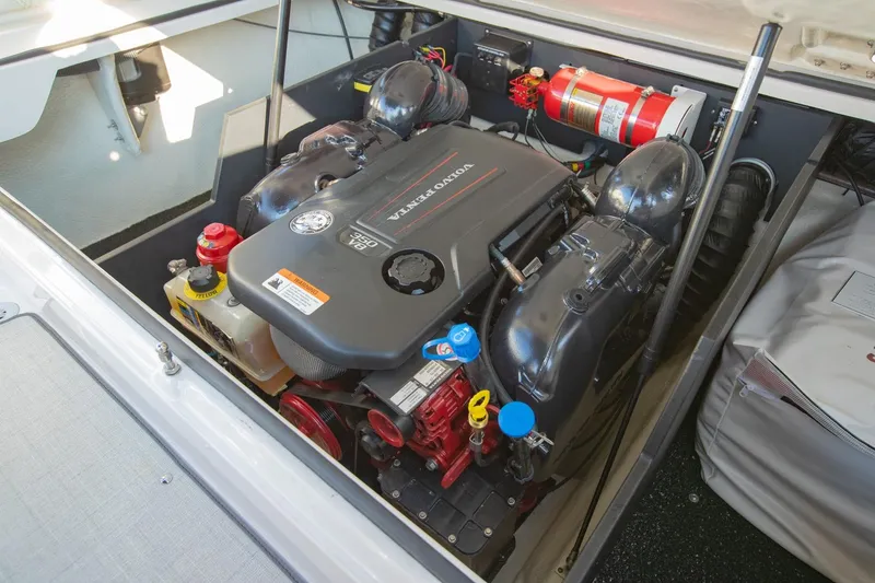 Slide: The Image of Engine compartment of 2020 Regal LS6 boat with Volvo Penta motor and safety equipment. - 32