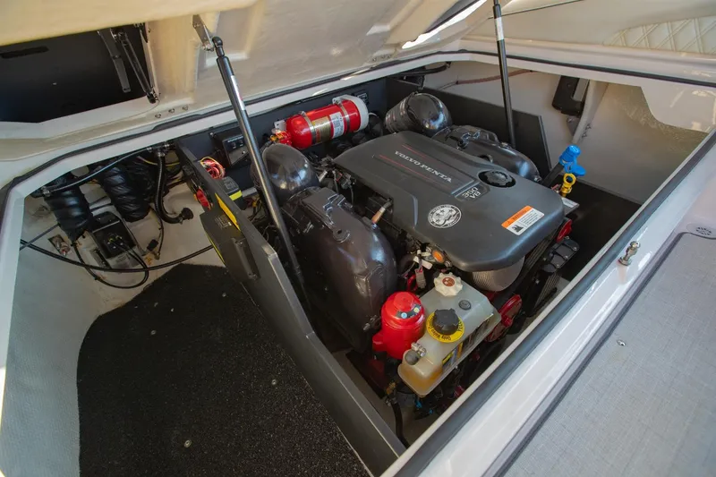 Slide: The Image of Engine compartment of a 2020 Regal LS6 boat featuring a Volvo Penta engine. - 34