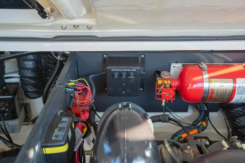 Slide: The Image of Engine compartment of 2020 Regal LS6 with actuator control box and fire extinguisher. - 36