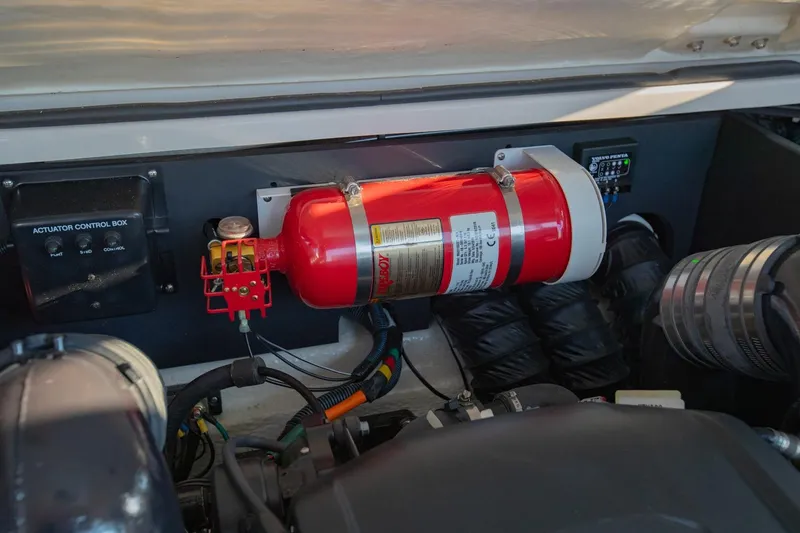 Slide: The Image of Engine compartment of 2020 Regal LS6 with fire extinguisher and control box. - 37