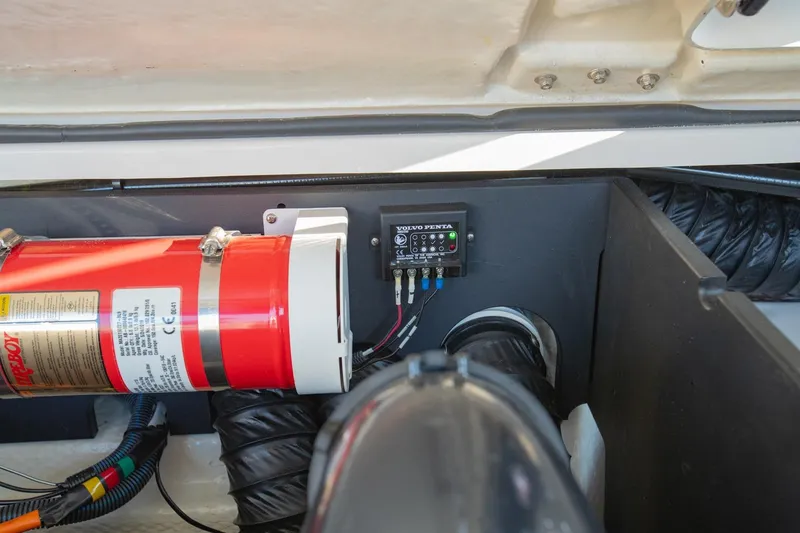 Slide: The Image of Engine compartment of 2020 Regal LS6 with fire extinguisher and Volvo Penta control panel. - 38