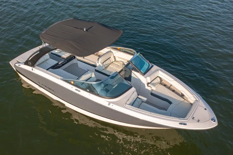Slide: The Image of 2020 Regal LS6 boat with canopy on calm water, aerial view. - 4