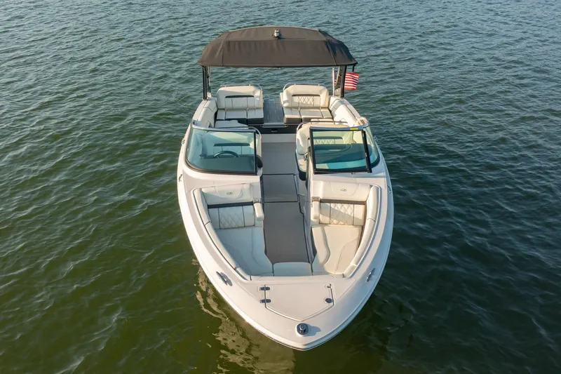 Slide: The Image of 2020 Regal LS6 boat on water, featuring spacious seating and sleek design. - 6