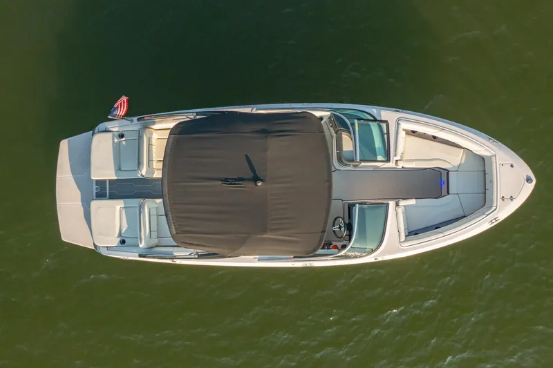 Slide: The Image of Overhead view of 2020 Regal LS6 boat on water, featuring sleek design and spacious seating. - 7