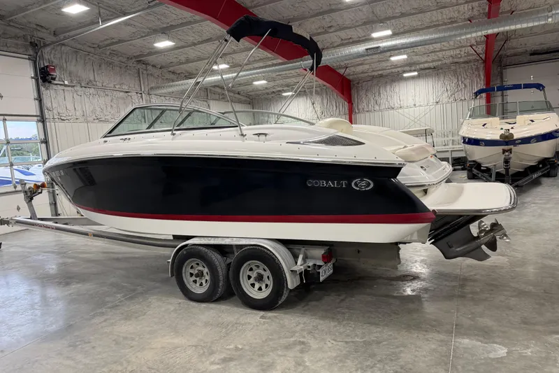 Slide: The Image of 2008 Cobalt 232 boat on trailer in indoor storage facility. - 3