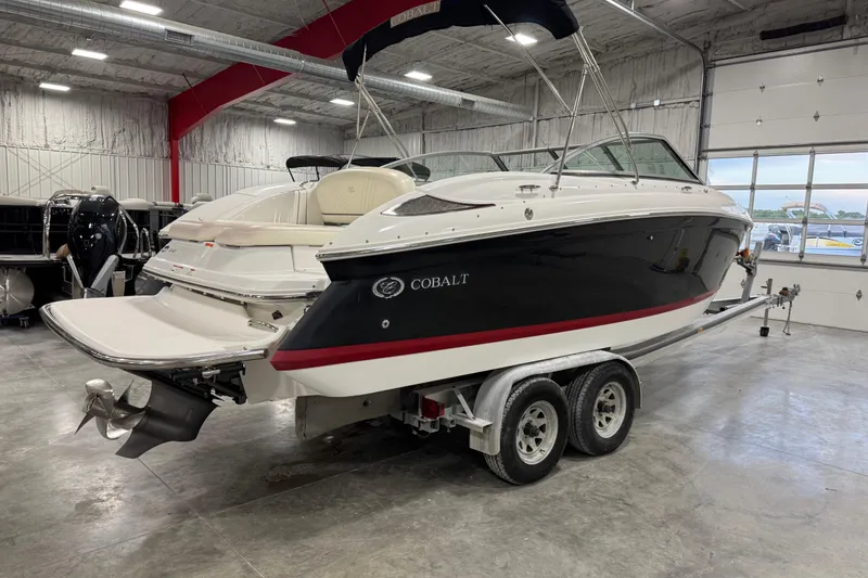 Slide: The Image of 2008 Cobalt 232 boat on trailer in indoor storage facility. - 4