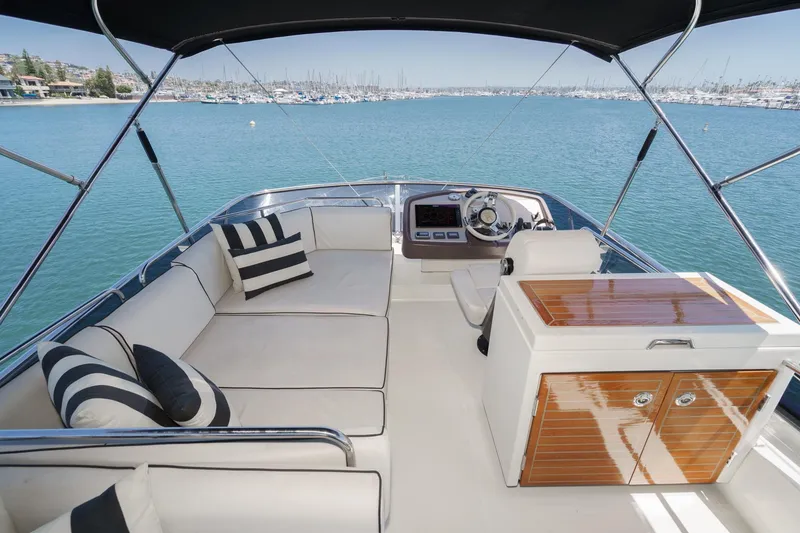 Slide: The Image of Luxurious 2017 Monte Carlo MC5S yacht interior with elegant seating and scenic ocean view. - 21