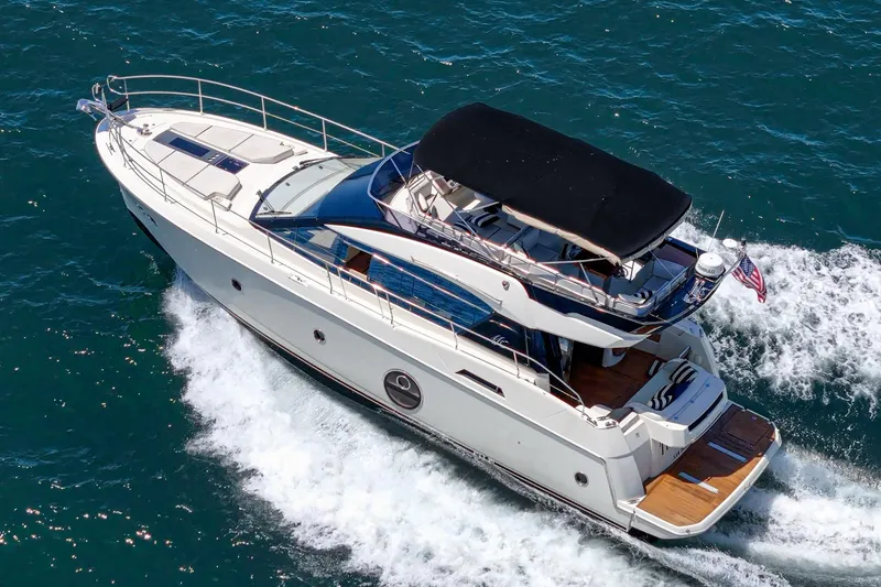 Slide: The Image of 2017 Monte Carlo MC5S yacht cruising on open water, aerial view. - 4