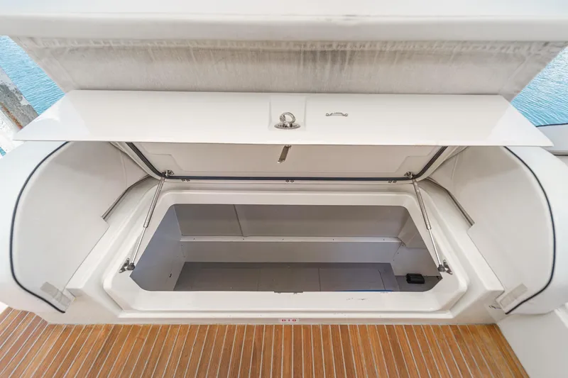 Slide: The Image of Open storage compartment on 2017 Monte Carlo MC5S yacht, featuring sleek design and ample space. - 59