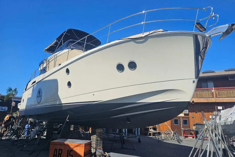 Slide: The Image of 2017 Monte Carlo MC5S yacht on dry dock, showcasing sleek design and modern features. - 71