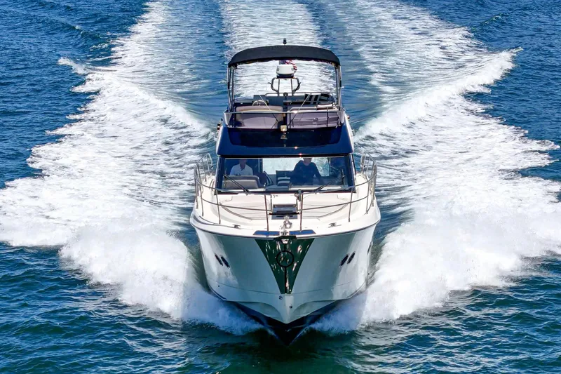 Slide: The Image of 2017 Monte Carlo MC5S yacht cruising on open water, creating a dynamic wake. - 17