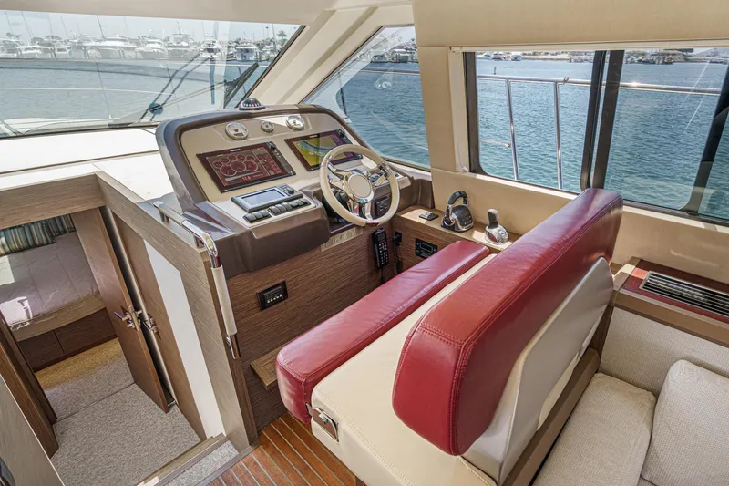 Slide: The Image of Interior of 2017 Monte Carlo MC5S yacht helm with modern controls and red seating. - 42