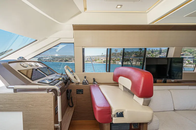 Slide: The Image of Luxurious interior of 2017 Monte Carlo MC5S yacht with red seating and scenic window view. - 43
